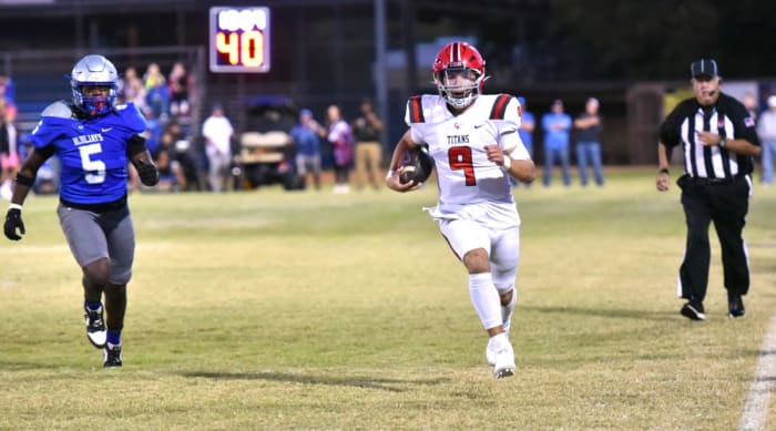 Midwest City Carl Albert quarterback Kevin Sperry runs for extra yardage during a recent game against Guthrie.